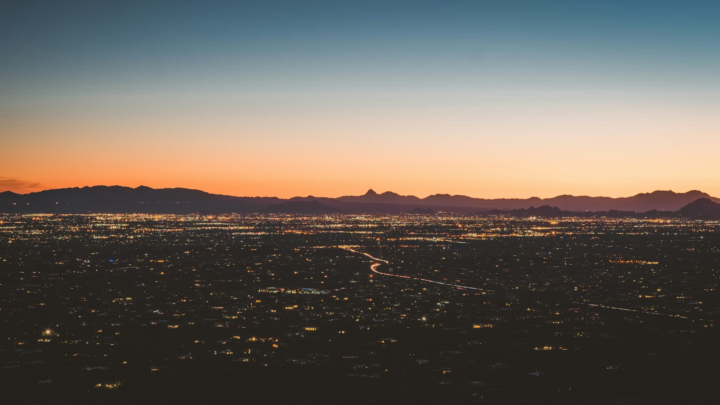 Tucson at dusk, with the Catalina Mountains in the distance